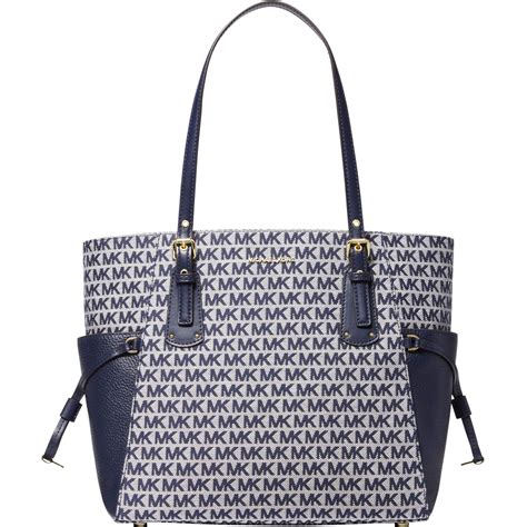 michael kors voyager east west tote admiral navy|Michael Kors voyager signature tote.